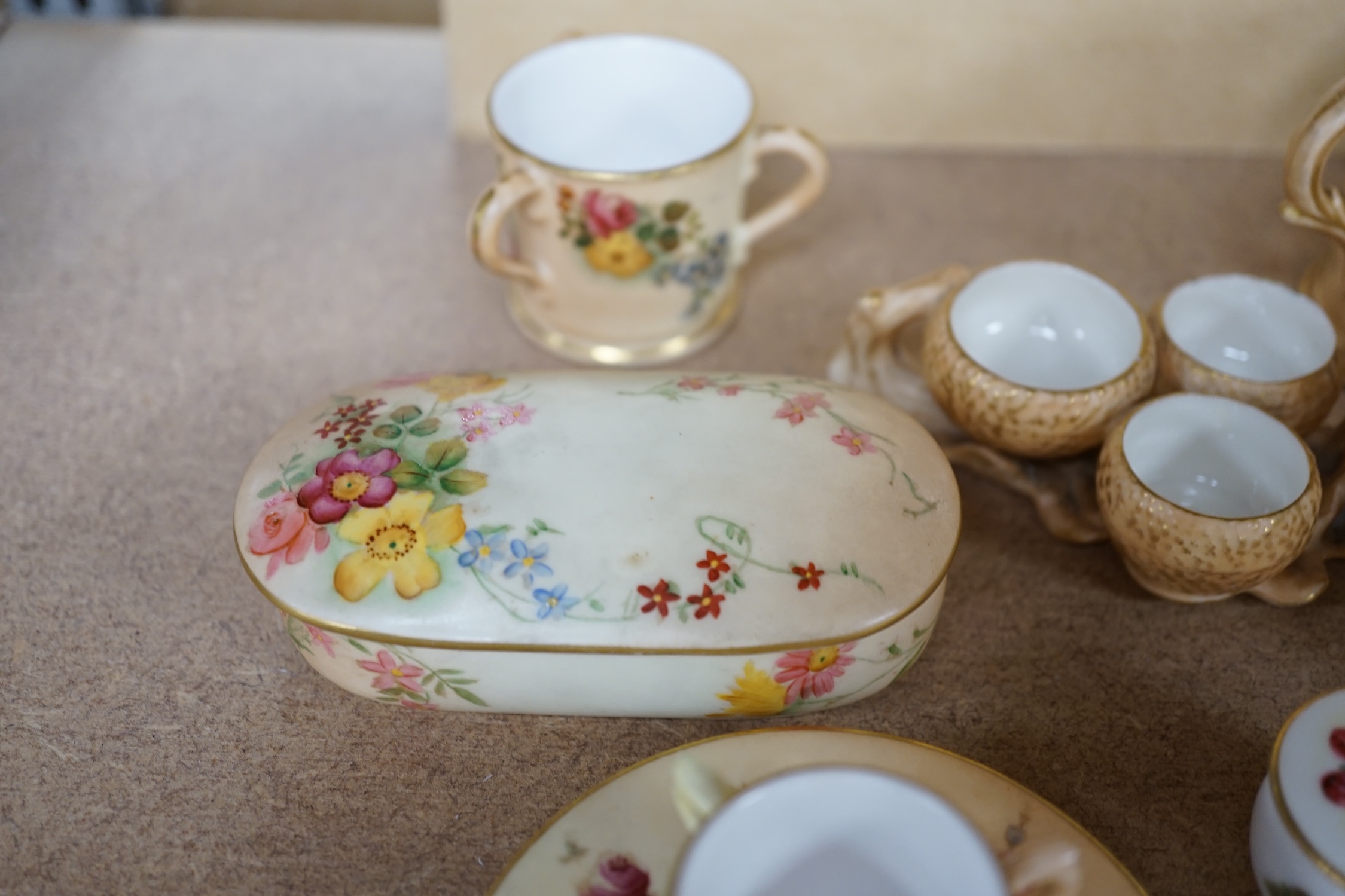 A group of Royal Worcester etc. miniatures including blush ivory tygs and a miniature fruit painted pot and cover, largest 6cm high (8). Condition - mostly fair